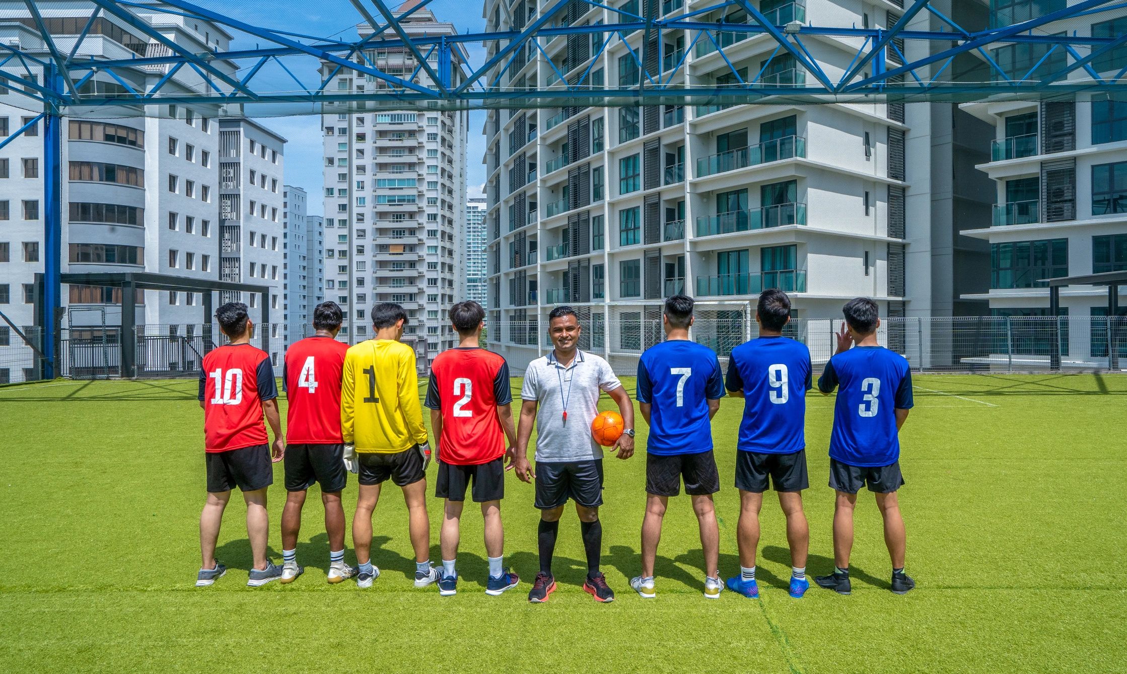 Football team in matching custom jerseys standing together